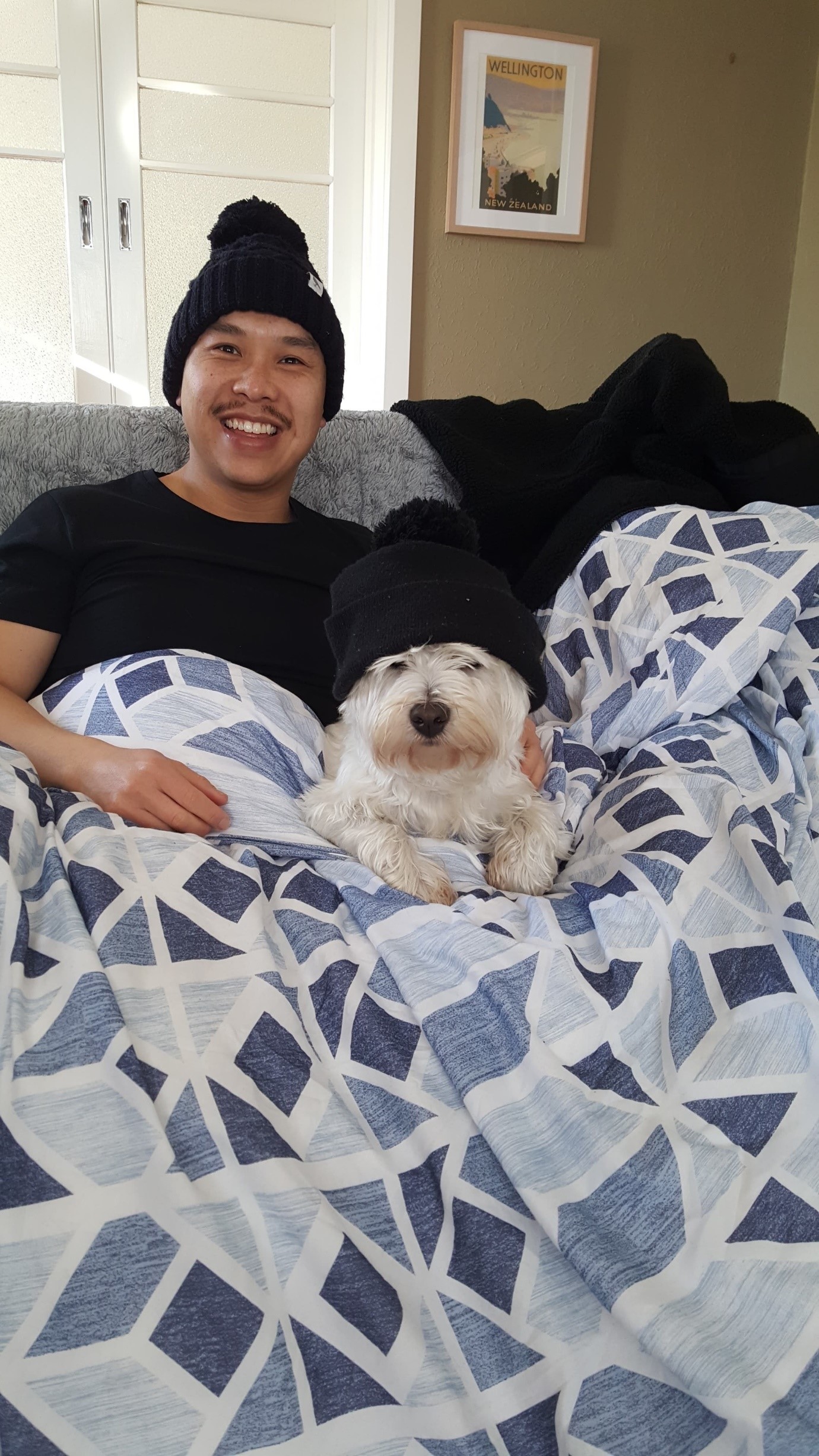 Tino and his dog Winston wrapped up snuggling