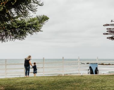 family looking out at beach