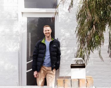 man outside house