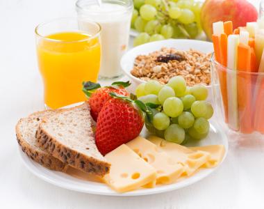 image of healthy food snacks, including fruit, milk and juice